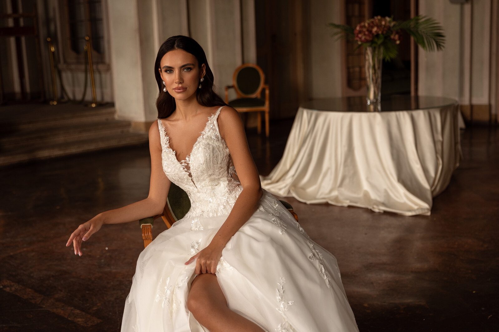 Νυφικό Malaga Α γραμμής σε καθιστή πόζα - Fashion Brides Σέρρες.
